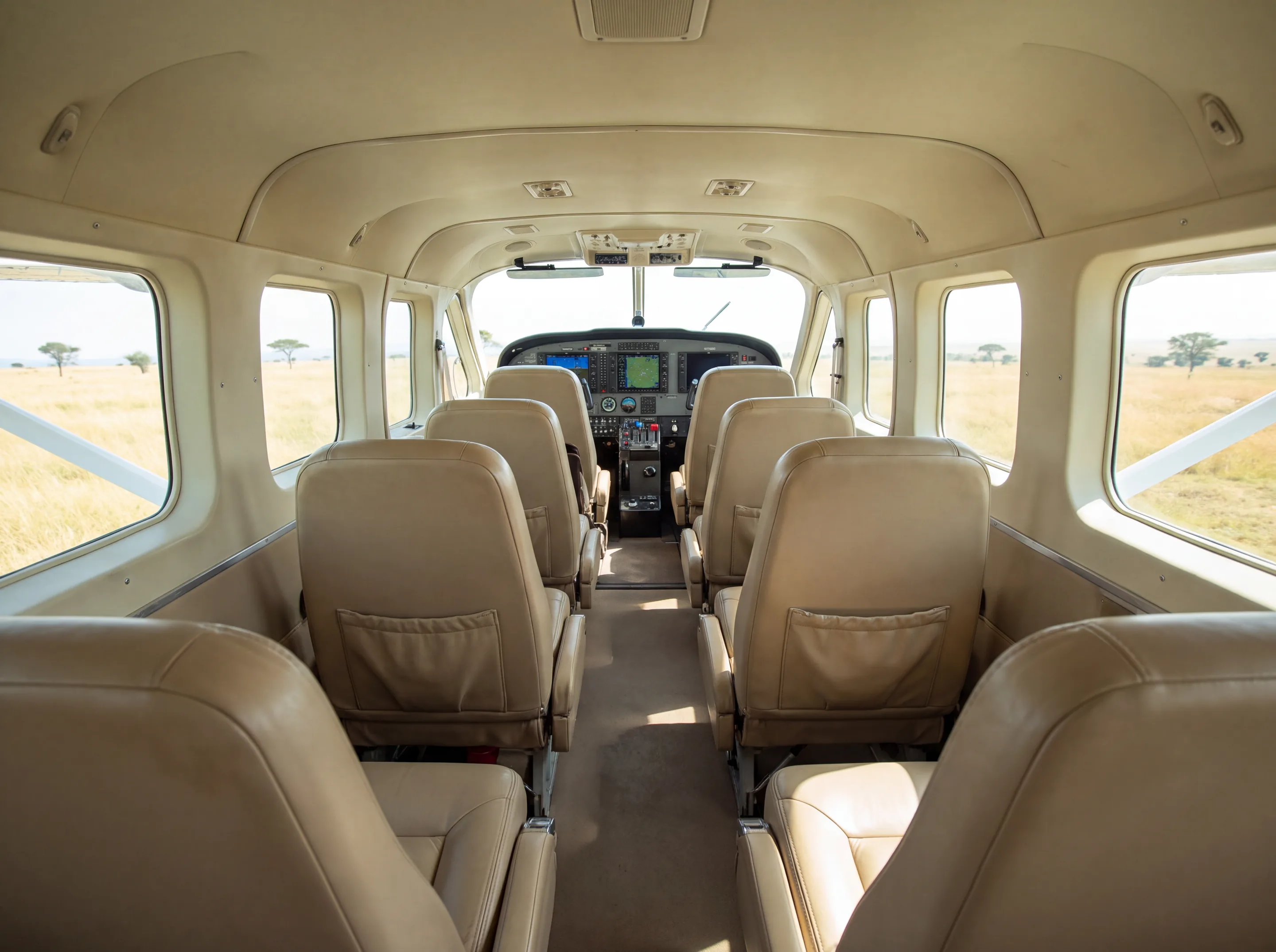 Grand Caravan cabin, savannah outside the windows (AI-generated illustration)