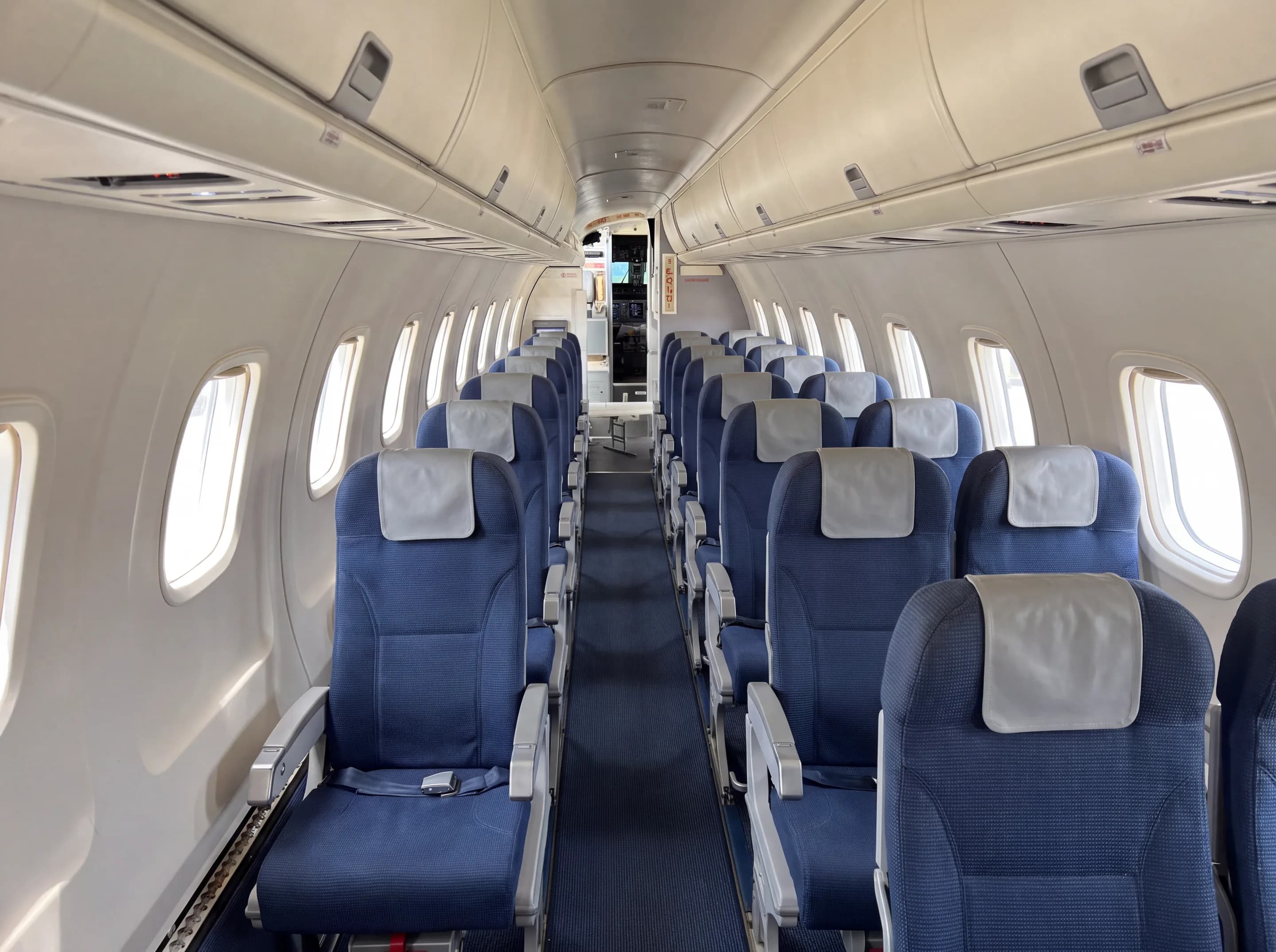 ERJ-145 cabin, one seat on the left of the aisle and two on the right (AI-generated illustration)
