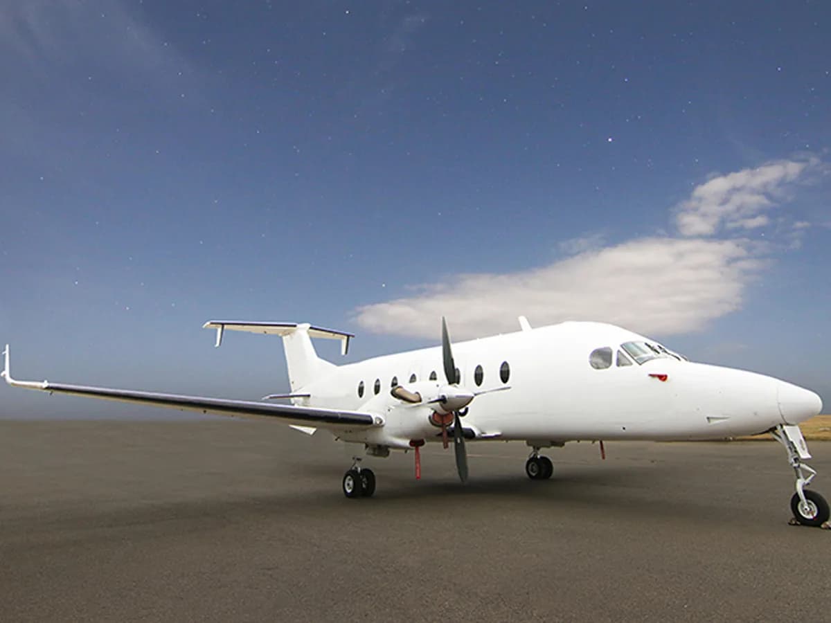 A Beechcraft 1900D on the apron at dusk