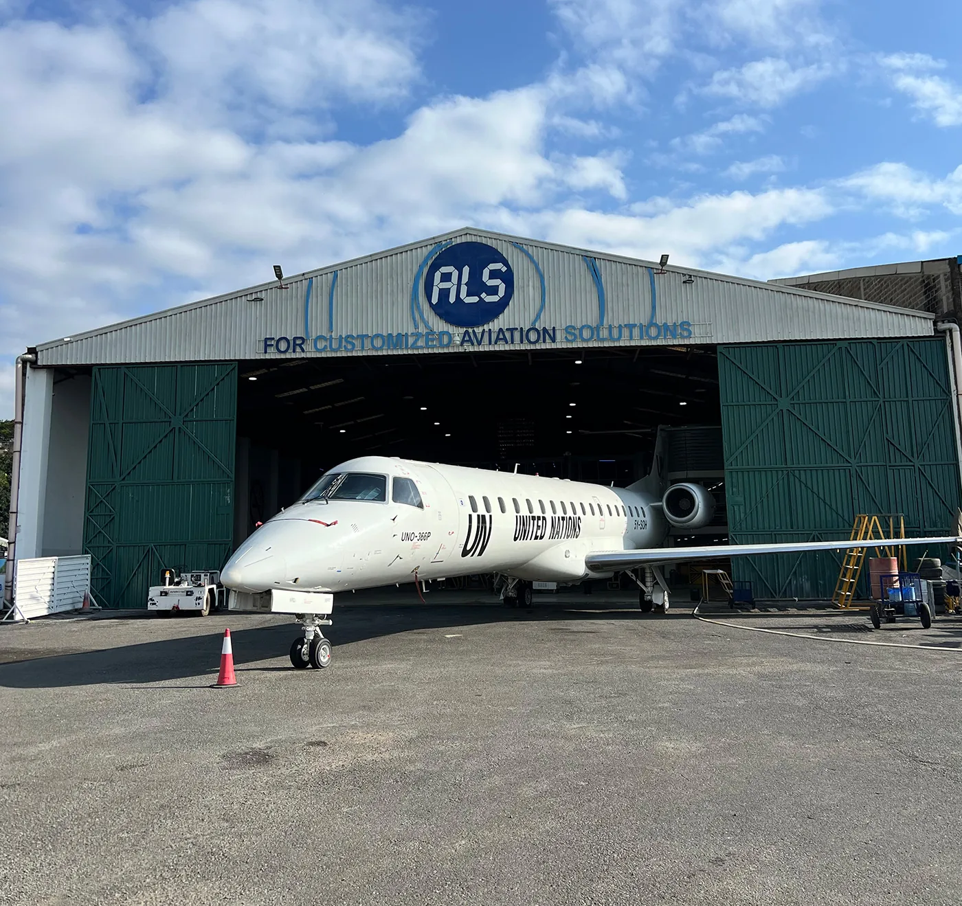 An Embraer ERJ-145 with United Nations titles outside the ALS hangar